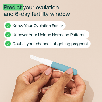 Hand holding white and teal fertility test wand with product information text above on beige background.