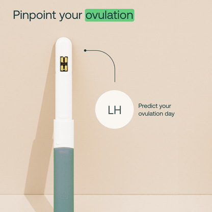 White and teal hormone monitor test device with gold sensor contacts and grip handle.