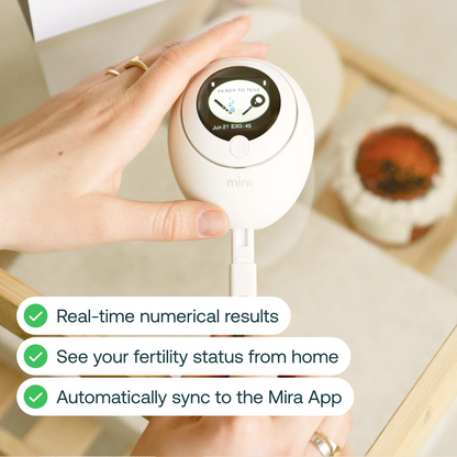Mira Fertility Monitor displaying ready to test screen with wand inserted, showing real-time hormonal results synced to app