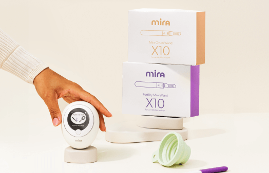 Mira Fertility menopause hormone tracking kit with monitor device, test wands, and packaging on white background