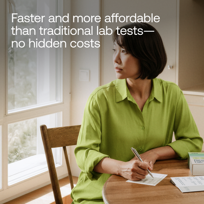 Woman in lime green shirt sitting at wooden table writing on Mira Panorama Perimenopause Lab Test paperwork.
