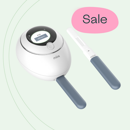 White Mira device with black control ring and display, accompanied by two blue-handled applicators.