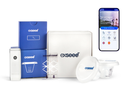ExSeed male fertility test kit with sperm analysis device, collection cups, packaging, and companion app on smartphone